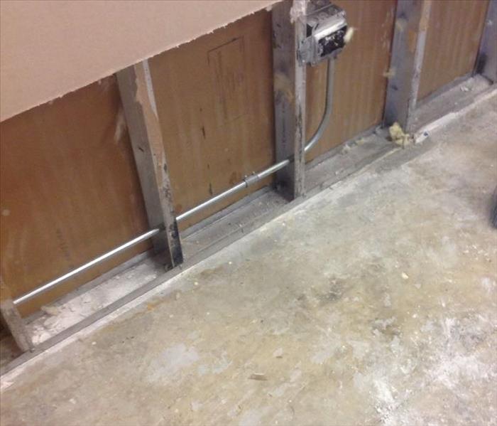 Removed flooring and drywall in a commercial property.